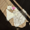 Close-up of cream ribbed bikini set with white floral lace beach cover-up on straw mat - S / Off White
