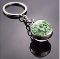 Detailed close-up of Van Gogh white roses oil painting in a glass ball metal keychain - White Rose Pendant