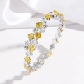 Detailed close-up of open bangle with alternating yellow and white square zircon stones - Lemon Yellow