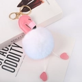 Detail of flamingo keychain with white faux fur pompom and pink leather on magazine - White - Gold Lobster Clasp