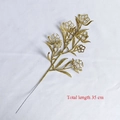 Detailed view of a 35cm gold glitter decorative branch with elegant cutout floral patterns - Rose