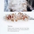 Elegant champagne gold bow hair clip with sparkling rhinestones and floral details - Yellow