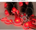 Detail of red and white Santa hat LED string lights with warm festive lighting glow - Christmas Hat