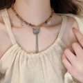 Vintage sandalwood beaded necklace with silver butterfly charms and tassel worn by a model - 7# Retro Butterfly Tassel Beaded Necklace (Coffee) (5650032047135)