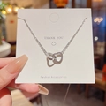 Silver interlocking heart and circle pendant necklace on a Thank You card display - X594 Silver Interlocking Heart and Circle