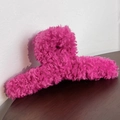 Macro detail of the fuzzy rose red plush fabric texture on a high-quality hair claw clip - Rose Red