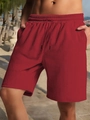 Macro shot of men's burgundy shorts showing herringbone texture and drawstring waist - S / Burgundy