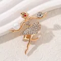 Elegant gold ballerina brooch with sparkling rhinestones and a white pearl accent - Ballet Dancer (RW0192)
