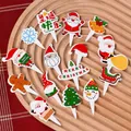 Christmas cake toppers set featuring Santa, Gingerbread Man and Tree on a wooden plate - Santa Blue Snowflake Cake Toppers 10 Sets