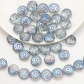 Detailed view of spiral round iridescent light blue crystal glass beads for DIY jewelry - Semi-transparent Blue