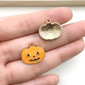 Halloween pumpkin lantern enamel pendant in orange and gold shown on hand - Yellow Round Pumpkin
