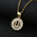 Macro view of gold letter U pendant with baguette zircons on a delicate chain - Gold Letter U