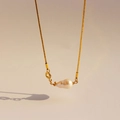 Minimalist golden necklace with a unique natural baroque pearl pendant on a fine chain - Oval Pearl Style