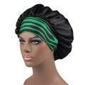 Detail view of the black satin hair bonnet with green striped elastic band on a model - 32cm / Black Green Zebra