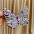 Elegant silver butterfly brooch with red ruby stones and hollow rhinestone design - Red and White Zirconia Butterfly Style (TB1055)