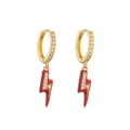 Close-up of golden lightning bolt earrings with red enamel and micro zircon inlay detail - Red Lightning