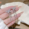 Elegant silver butterfly tassel earrings with sparkling cubic zirconia on a white shell - Silver Butterfly Tassel (E0340)