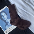 Dark brown ribbed high elastic mid-calf socks displayed on aesthetic black fabric - Short Brown