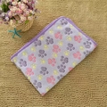 Soft purple flannel pet blanket with colorful paw prints and reinforced stitched edges - Purple Paw Print