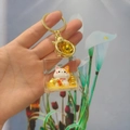 Golden fortune cat oil-filled liquid keychain with gold glitter and acrylic case - Maneki Neko - Fortune