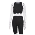 Close-up of black ribbed texture fabric on the athletic sports vest and cycling shorts - S / Black