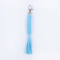 Light blue handmade macrame keychain featuring a silver clasp and cotton fringe detail - Moonlight Blue
