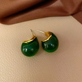 Vintage style green drop earrings with gold trim and silver needles on leather background - 27# Stud Earrings-Green Resin Bean