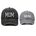 Detail of embroidered MOM and MINI text on washed denim baseball caps for families - Black MOM + Gray MINI (Set)