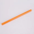 Detailed view of a reusable orange Tritan plastic straw with 1cm wide diameter hole - 1*20cm / Tropical Orange