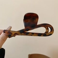 Close-up of minimalist tortoiseshell plastic hair claw clip with cross design details - Cross / Brown