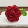 Handmade red crochet rose with green leaves on a book, knitted flower gift decor - Pointed Pure Red