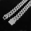 Macro detail of silver hip hop Cuban chain with triple-row rhinestones and box clasp - 50cm / Silver