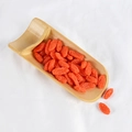 Realistic dried goji berries in a bamboo tray on white fabric background - Goji Berries (500g)