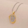 Macro view of gold-plated letter T pendant with pavé cubic zirconia on silver bead chain - Letter T