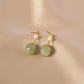 Vintage freshwater pearl and green jade drop earrings on champagne silk background - Hetian Jade Single Pearl Stud Earrings