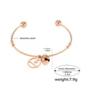 Bracciale rigido aperto in acciaio inossidabile oro rosa con ciondoli a cerchio e campanelli - Campanello Oro Rosa Piastra Rotonda (Z395)