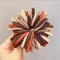 Elastic fabric scrunchies set in cream, orange and brown colors held by hand - Coffee Wavy 100Pcs with Jar