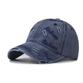 Close-up of Kindness embroidery and distressed detail on washed denim baseball cap - Adjustable / Navy Blue