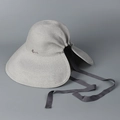 Detail of grey straw sun hat featuring a rear split, ribbon bow, and silver metal logo - M(56-58cm) / Gray