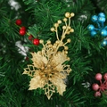 Golden glitter artificial poinsettia with berries on Christmas tree decoration branch - Gold