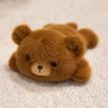 Plush brown bear magnet with fluffy long fur in a cute lying pose on white soft wool - Brown Bear