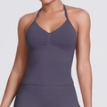 Detail of dark purple seamless yoga halter top with V-neckline and front pleat texture - Truffle