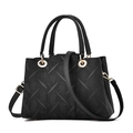 Classic black embossed handbag with geometric relief pattern and gold metal ring handle - Black