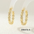 Macro view of gold C-shaped hoop earrings with teddy bear silhouettes and cubic zirconia stones - ER0476-A Teddy Bear Design