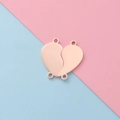 Vista macro di ciondoli a cuore in oro rosa per braccialetti fai-da-te scomponibili - Set Oro Rosa