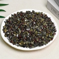 Polished dark green and black natural crushed crystal stones displayed in a white dish - Dragon Blood Stone (5-7mm) 100g