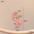 Detailed macro view of cherry blossom pendant with gold alloy, resin and white pearls - Pink Cherry Blossom (3909)