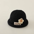 Detail of black fleece bucket hat with cream knit flower and Lucky fabric label - 4-10 Years / Black