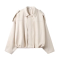 Detailed view of cream-colored faux leather bomber jacket with zip-up design and collar - XS / Apricot