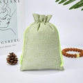 Light green linen drawstring pouch with neon yellow cord for jewelry storage - Fruit Green